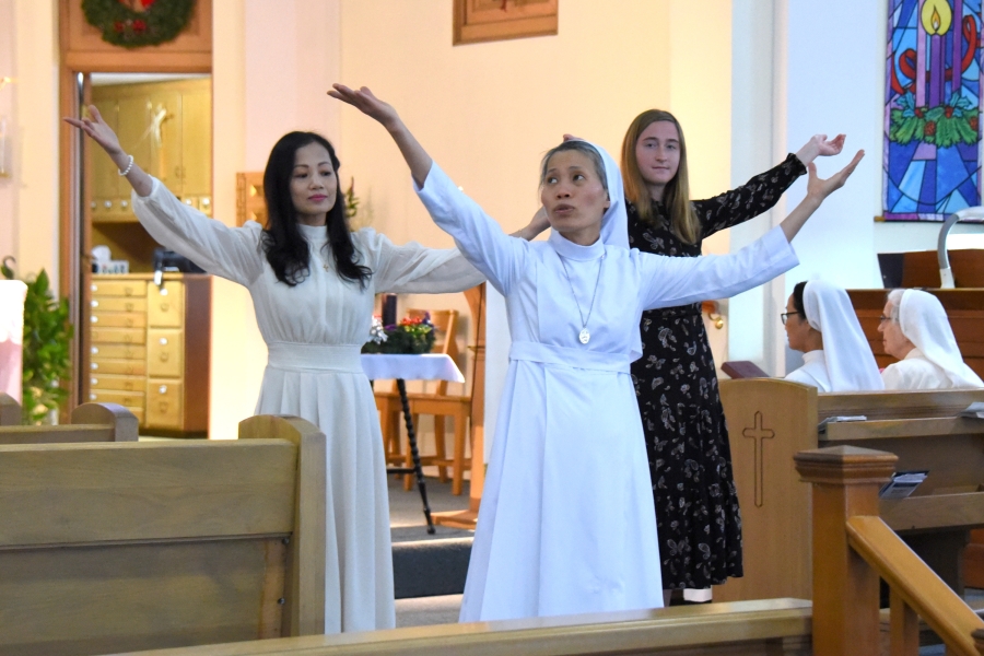 The Vietnamese Sisters perform a dance.