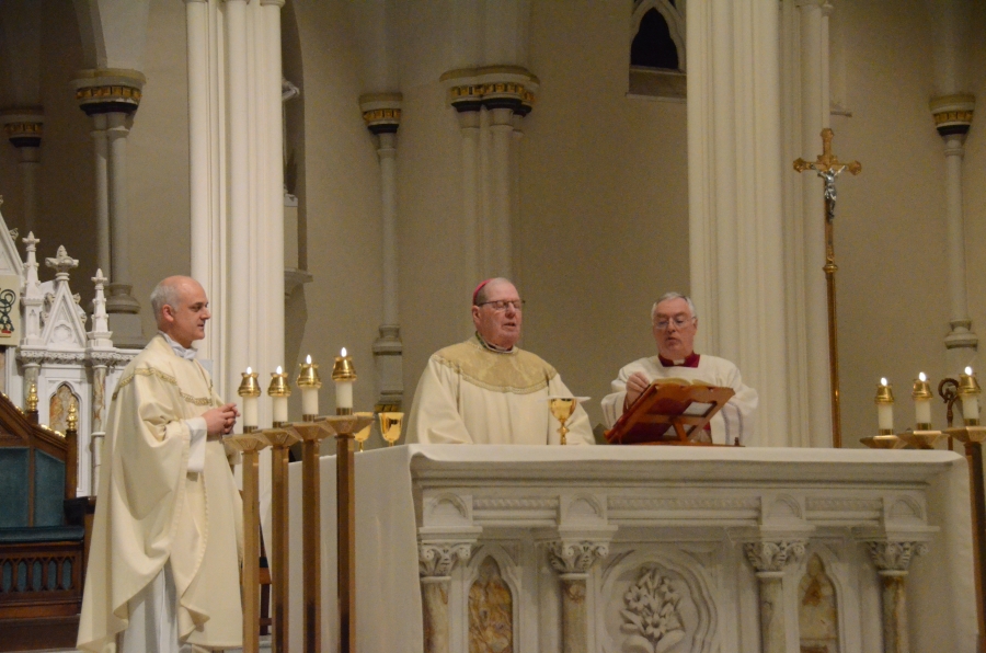 Bishop stands at the altar