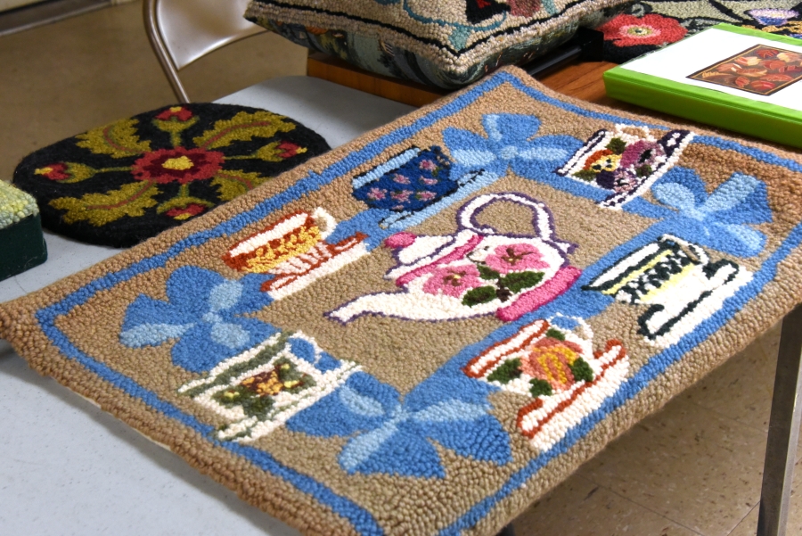 Rug featuring teacups.