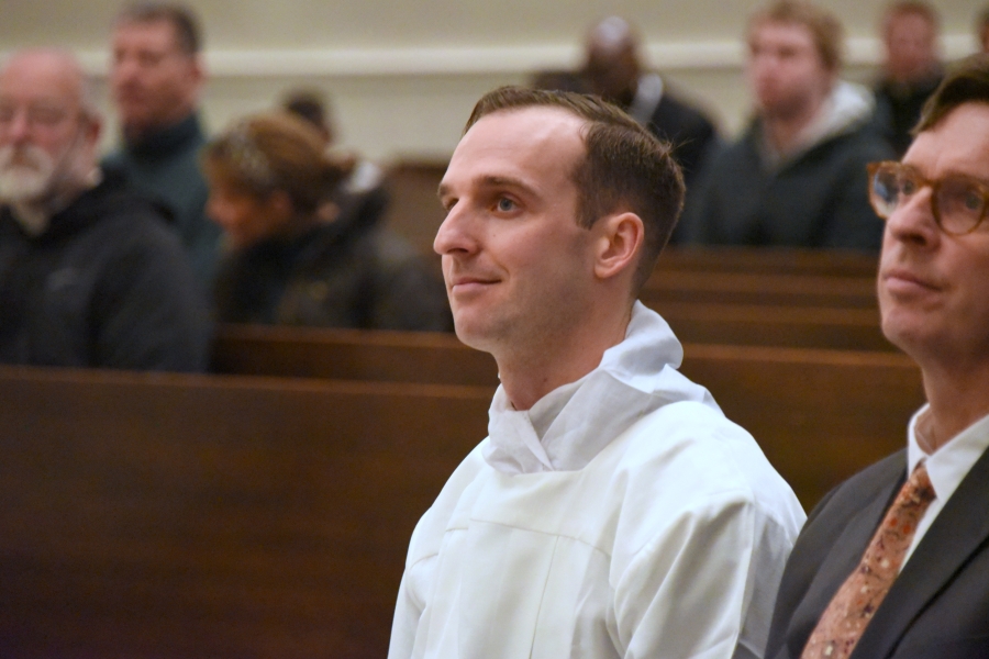 Matthew Valles listens to the homily.