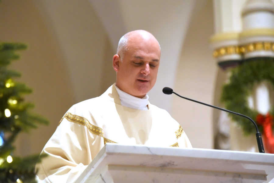 Father Seamus Griesbach reads the Gospel.