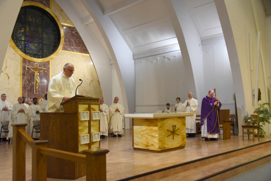 Deacon Donald Clavette reads the Gospel.
