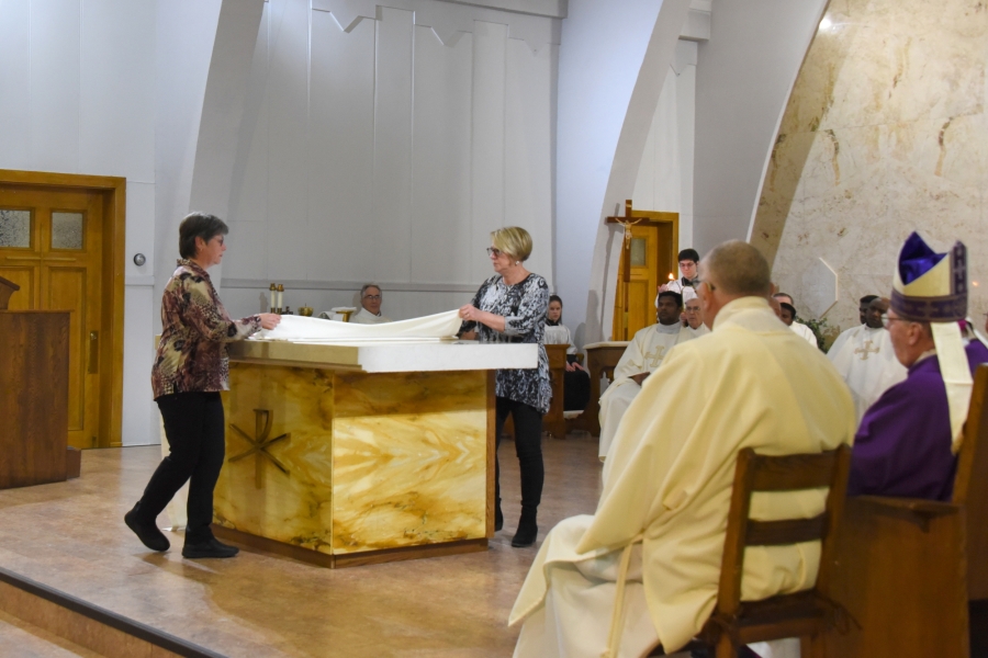 Dressing the altar for the first time with altar cloths.