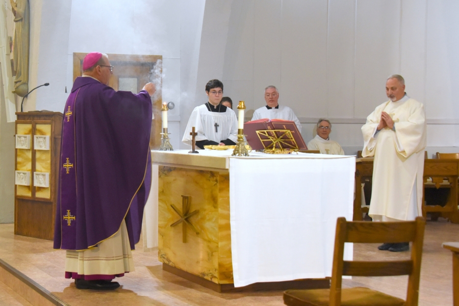 Bishop Deeley incenses the altar.