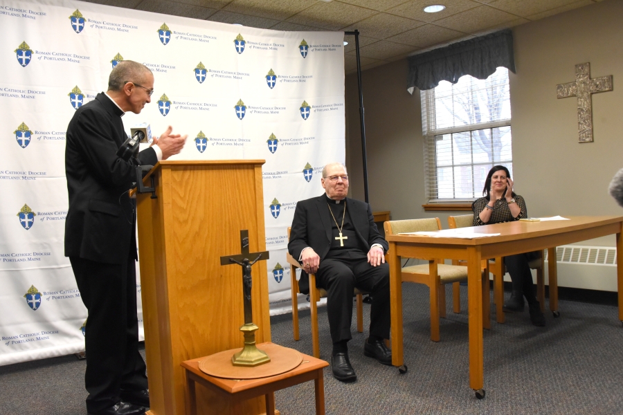 Bishop-Elect James Ruggieri applauds Bishop Robert Deeley