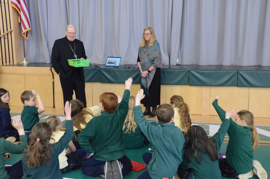 The bishop speaking to a group of students