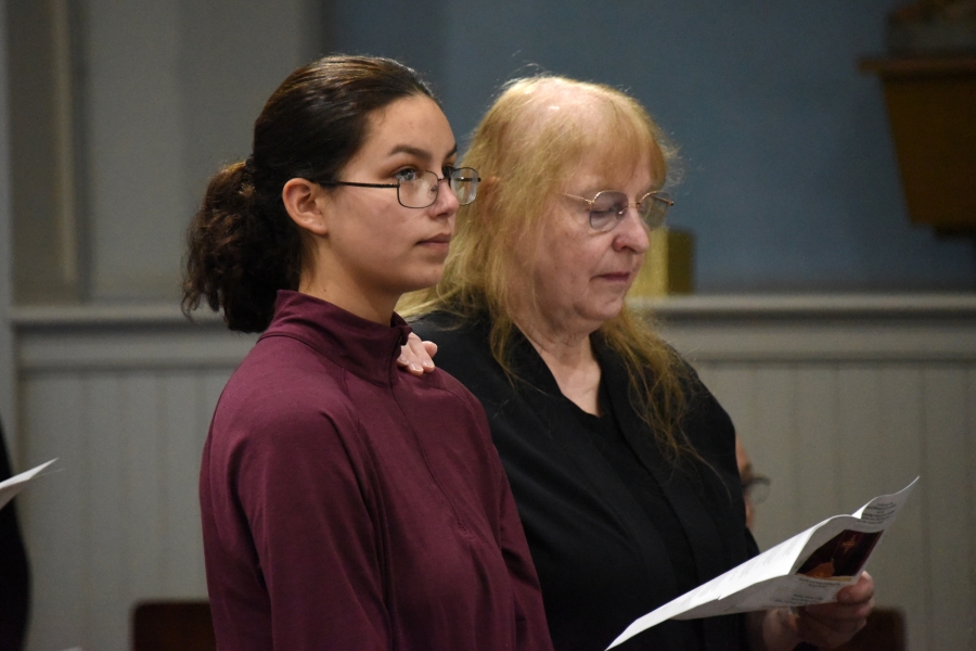 Two women standing at the Rite of Election in Presque Isle.