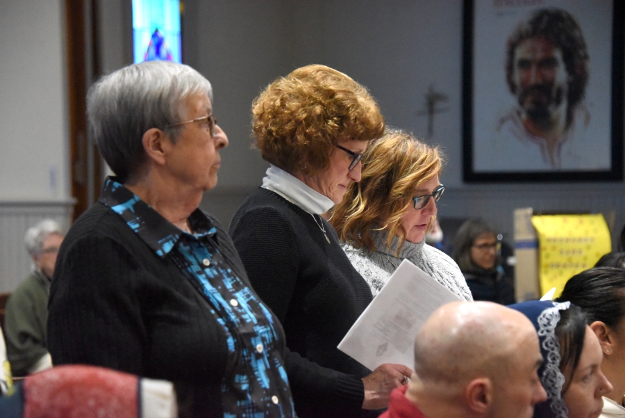 Women standing at the Rite of Election in Presque Isle.