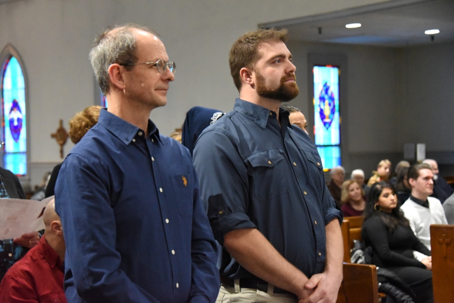 Two men standing at the Rite of Election in Presque Isle.