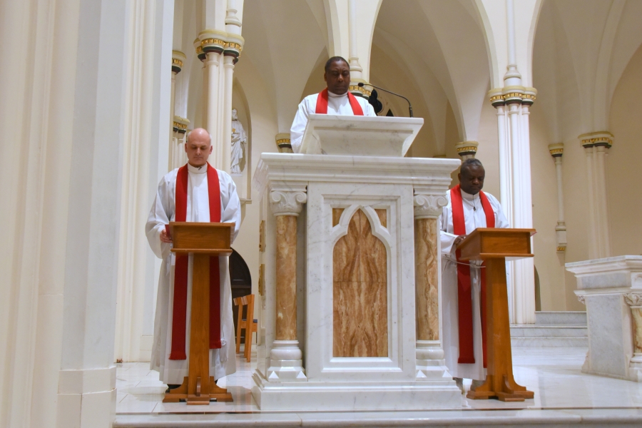 Father Seamus Griesbach, Father Cyprian Ferdzefer, and Father Augustine Kifon share the Passion story.