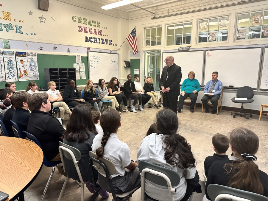 Bishop speaking to a class