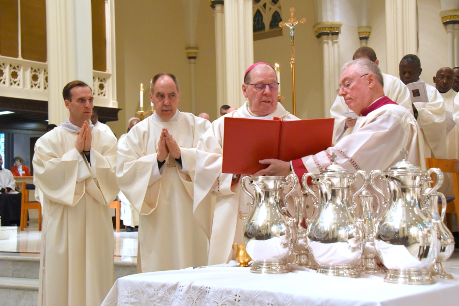 Bishop Deeley consecrates the oil of sacred chrism.