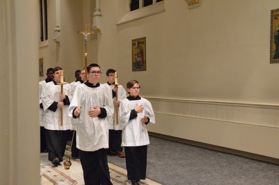 altar servers process into mass