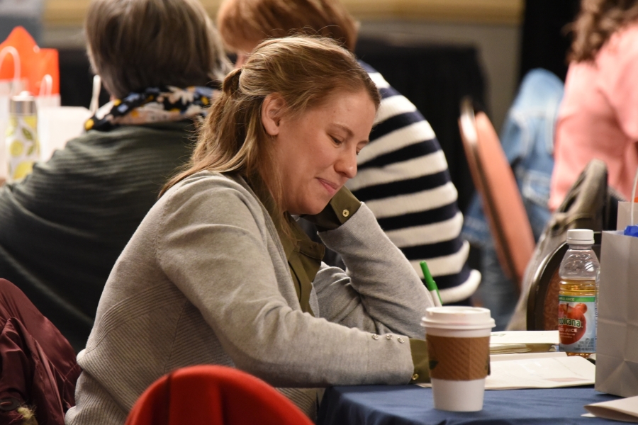 Woman writing in a journal.