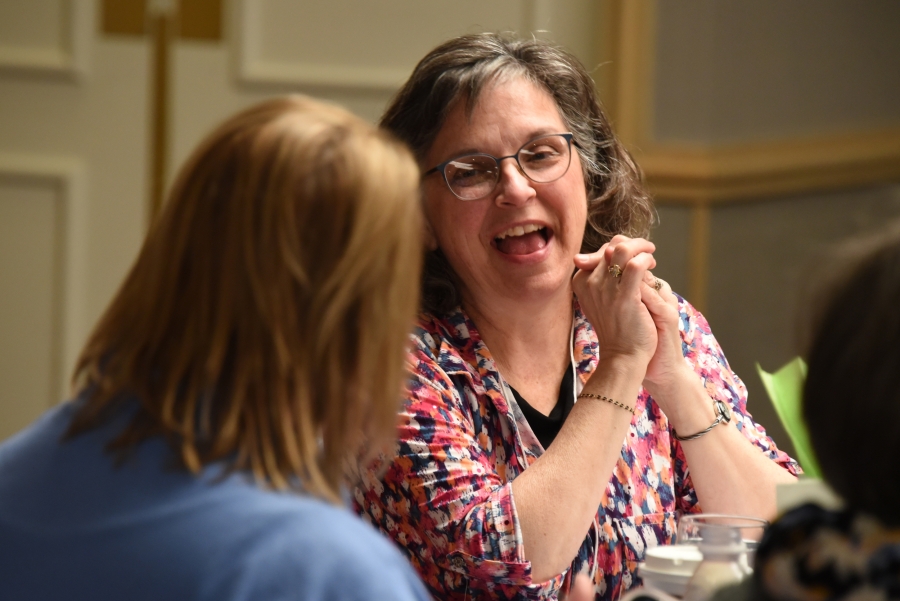 Two women laughing.