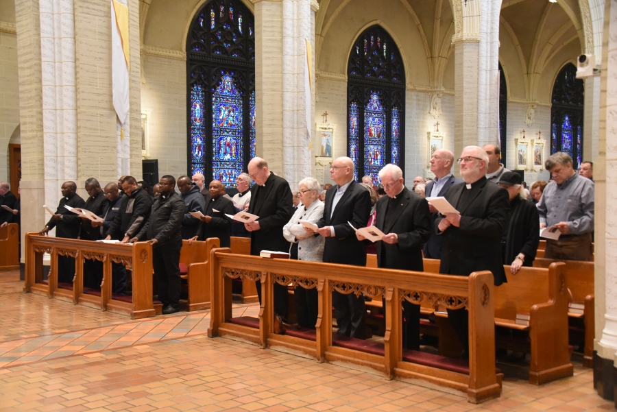 Priests and family members fill the front pews.