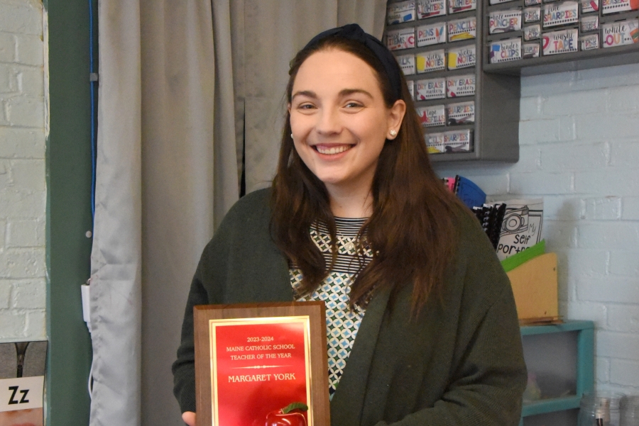 Maggie York with the Teacher of the Year Award