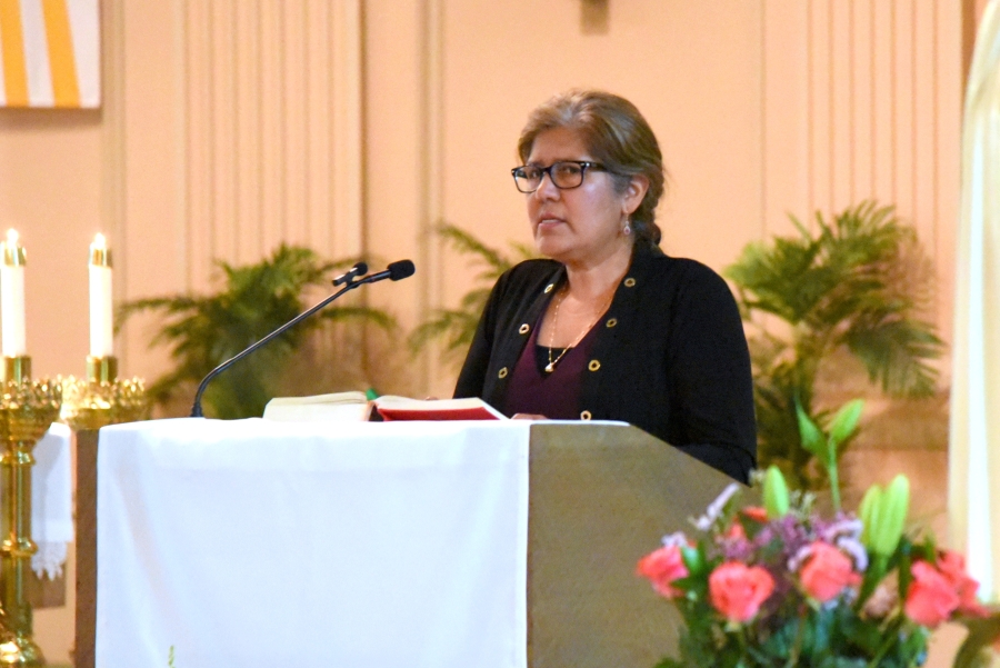 Woman sharing the first reading.