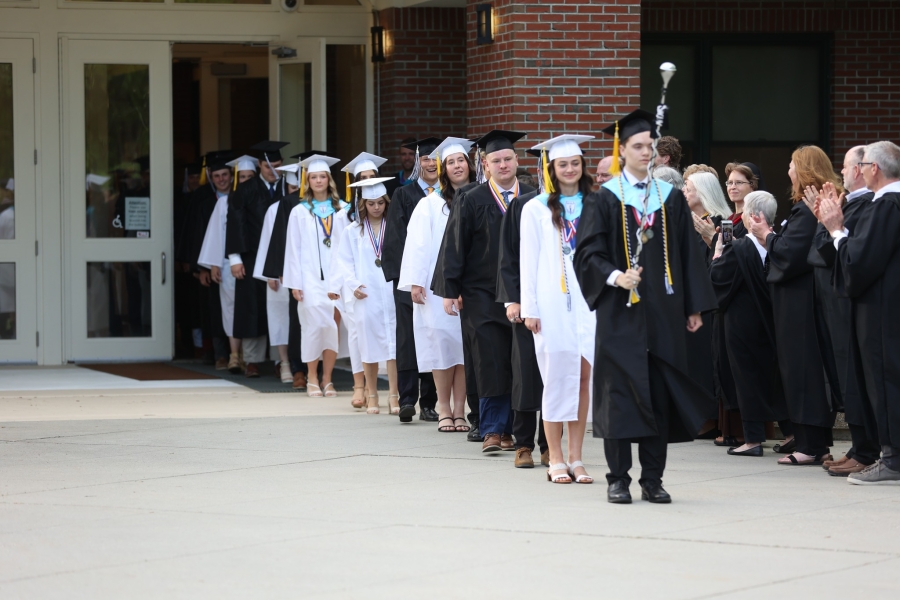 graduates marching to the graduation 