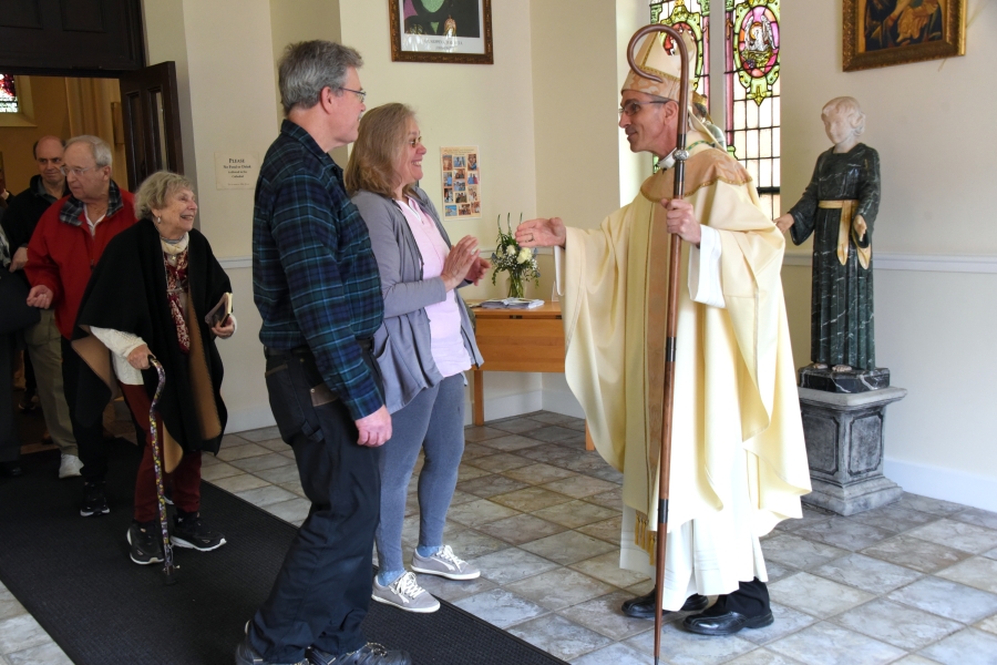 Greeting people after Mass.