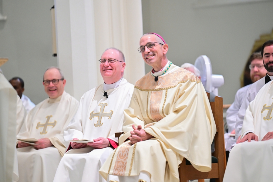 Bishop Ruggieri and Msgr. Dubois laugh at a statement made by Cardinal Pierre.