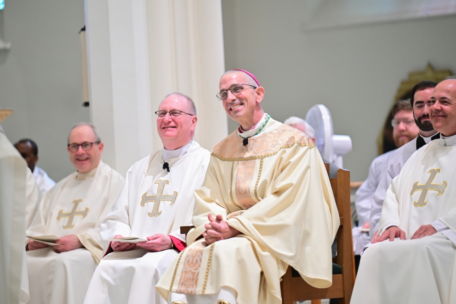 Bishop James Ruggieri, Msgr. Andrew Dubois, and other clergy.