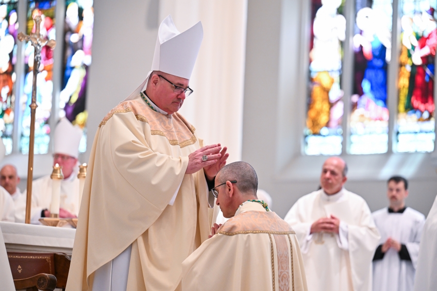 Bishop Deeley lays hands on Bishop-elect James Ruggieri