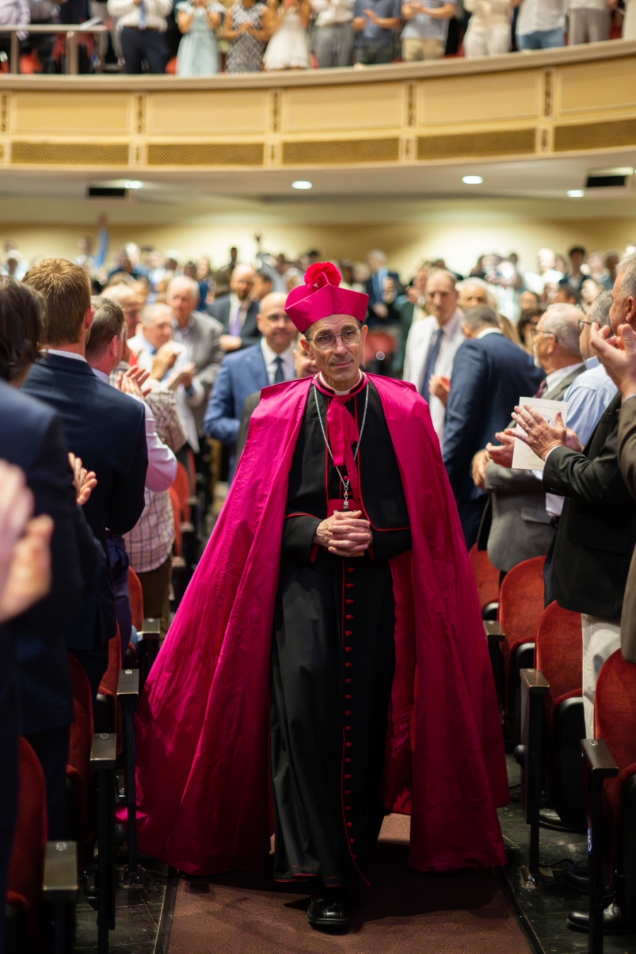 Bishop walking in the crowd 