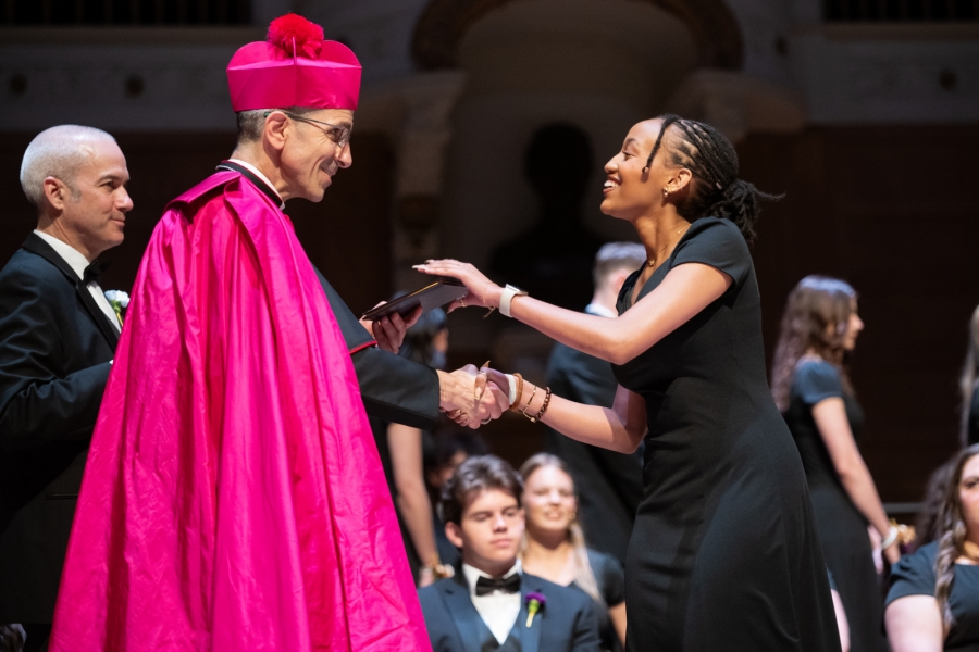 Bishop Ruggieri handing out diplomas