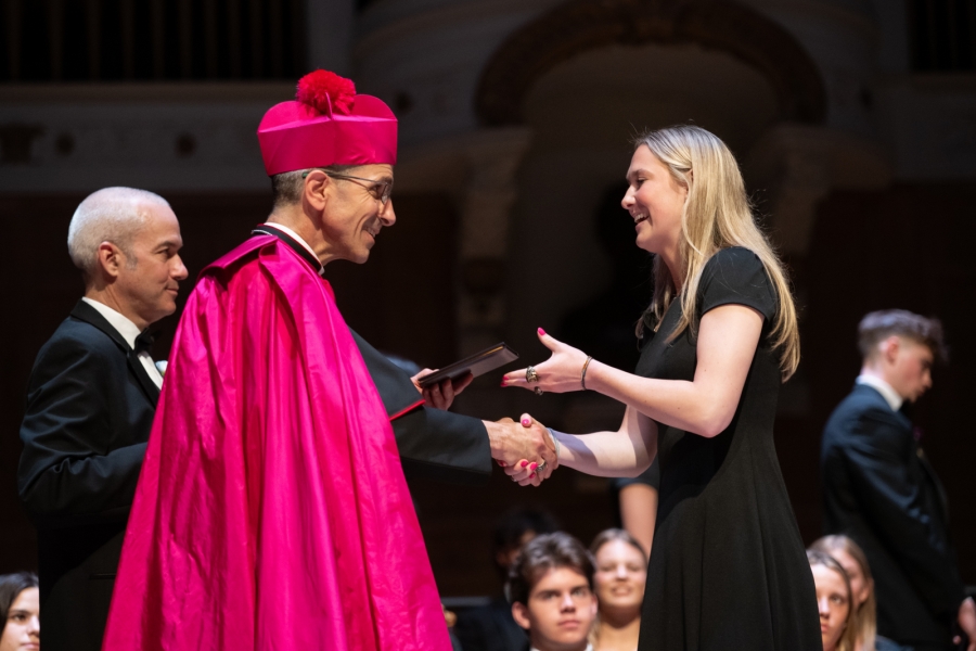 Bishop Ruggieri handing out diplomas