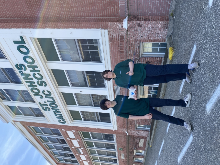 students holding a satellite at school 