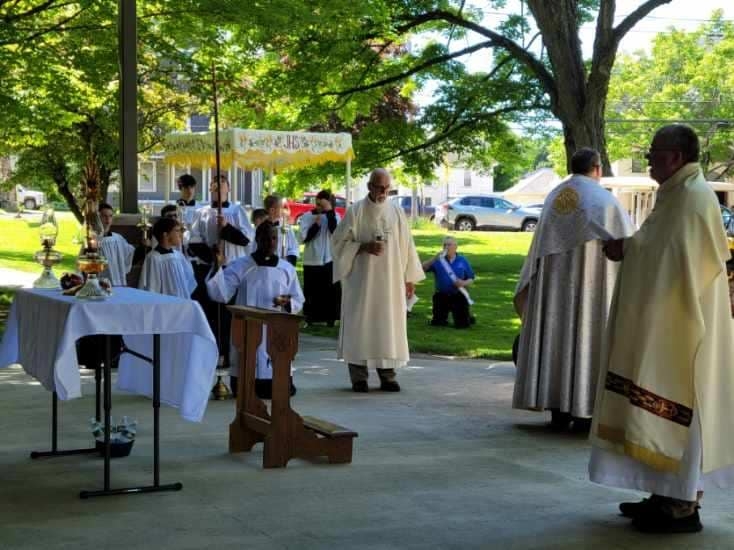 people walking in the Feast of Corpus Christi Procession