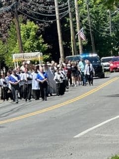 people walking in the Feast of Corpus Christi Procession