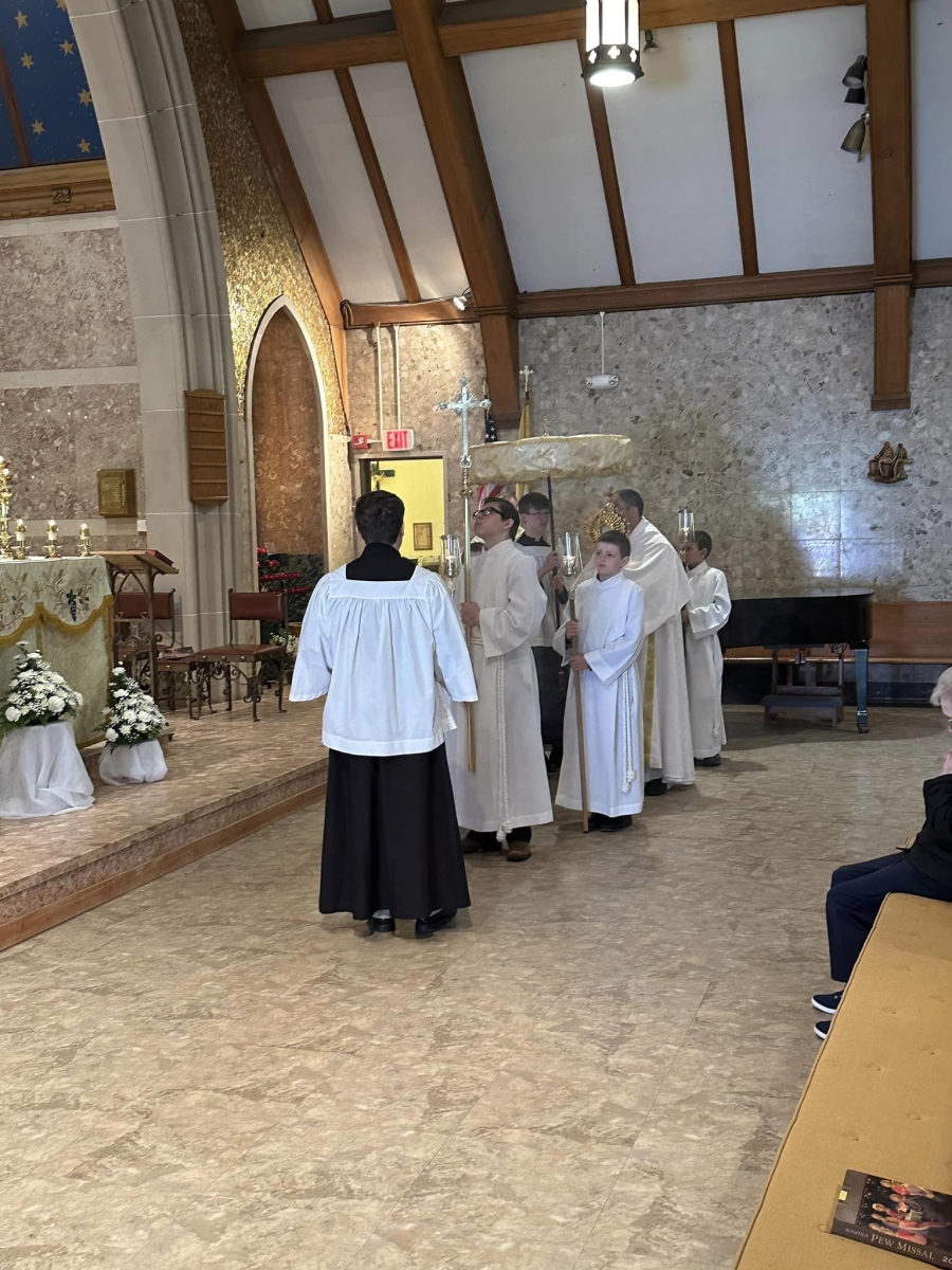 praying in the Corpus Christi Procession