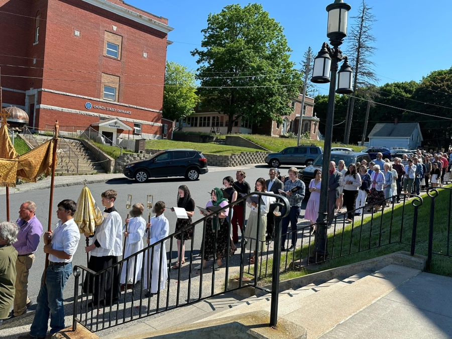 people lined up in the Corpus Christi procession outside