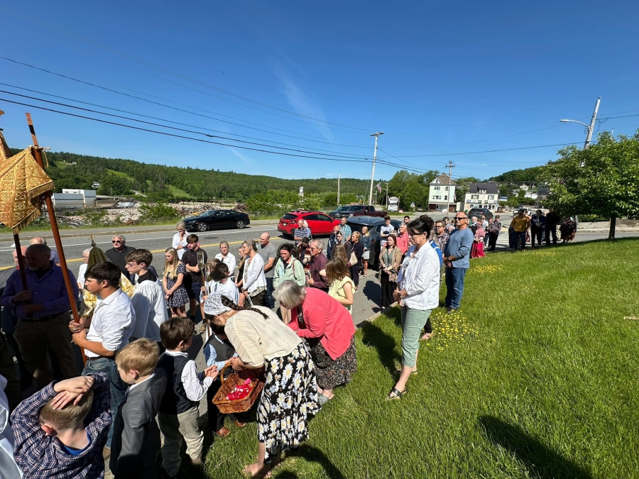 people lined up in the Corpus Christi procession outside