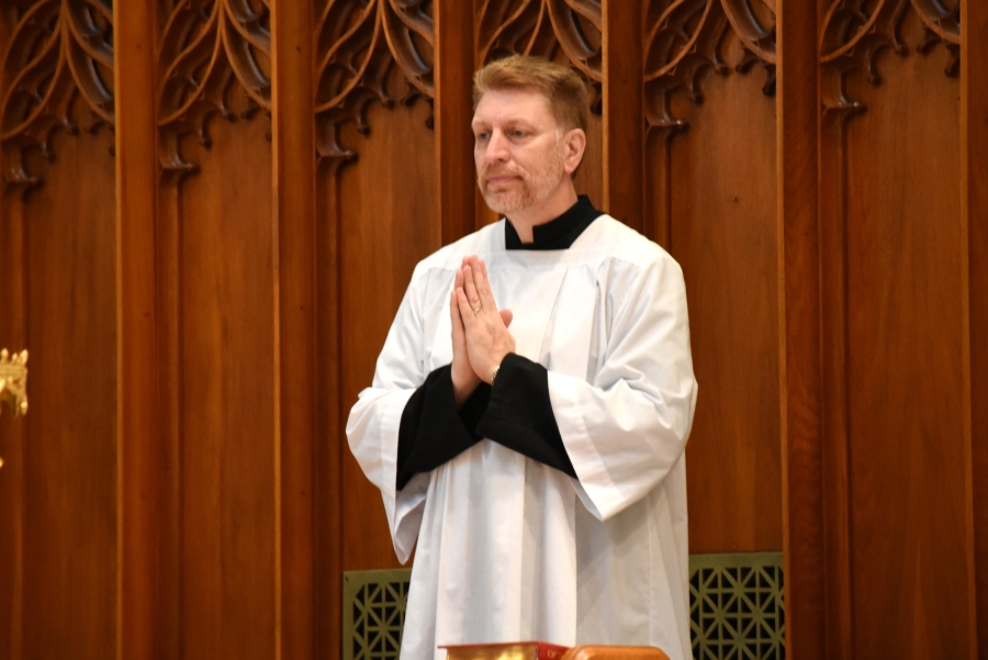 Brian Wilson wearing a cassock.