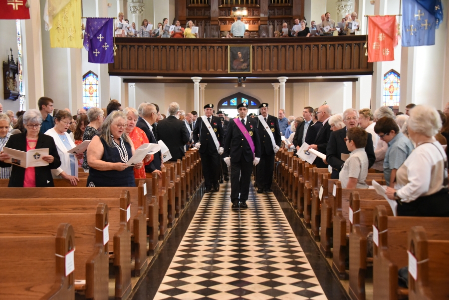 Knights of Columbus process into church.