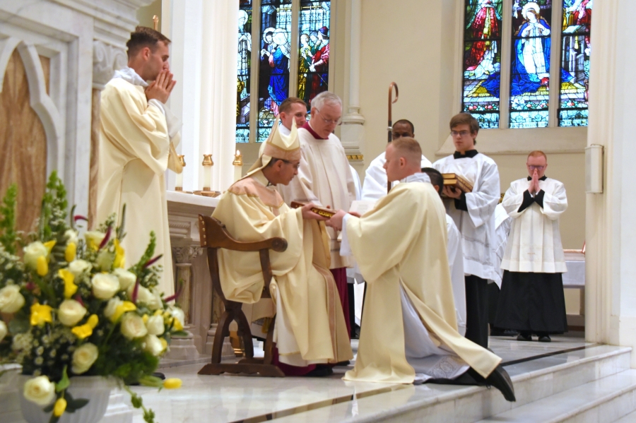 Deacon Erin Donlon is presented with the Book of the Gospels.