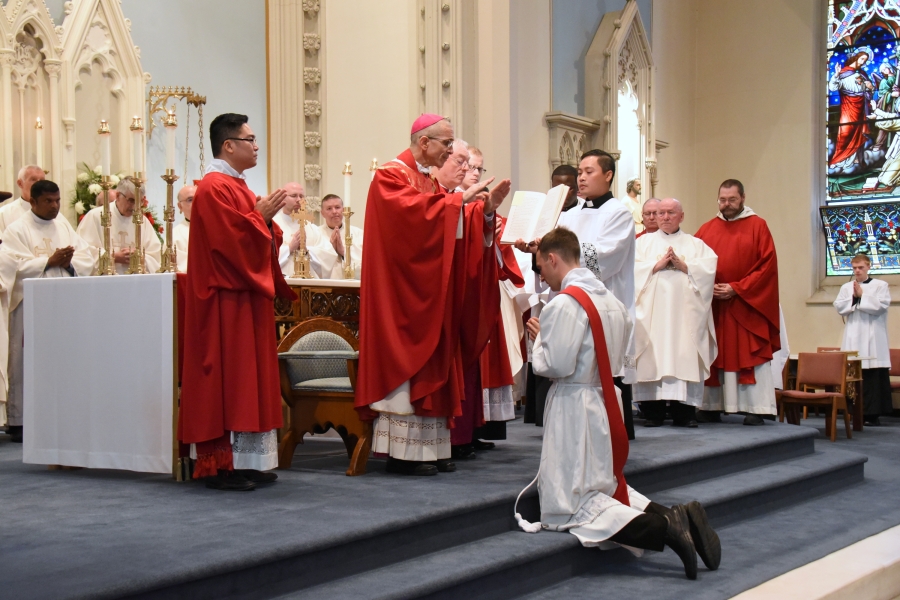 Bishop James Ruggieri prays the Prayer of Ordinatin.