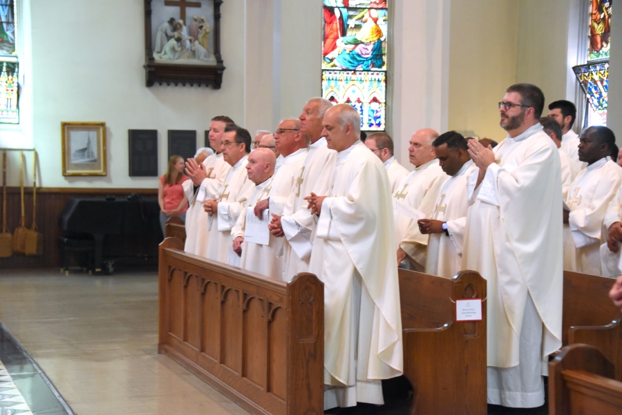 Priests in pews.
