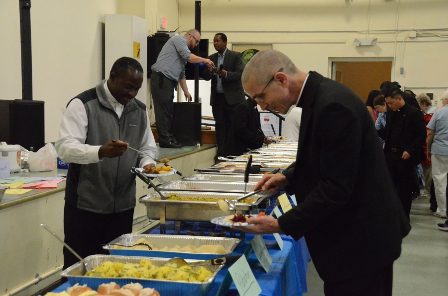 Priests serving themselves food