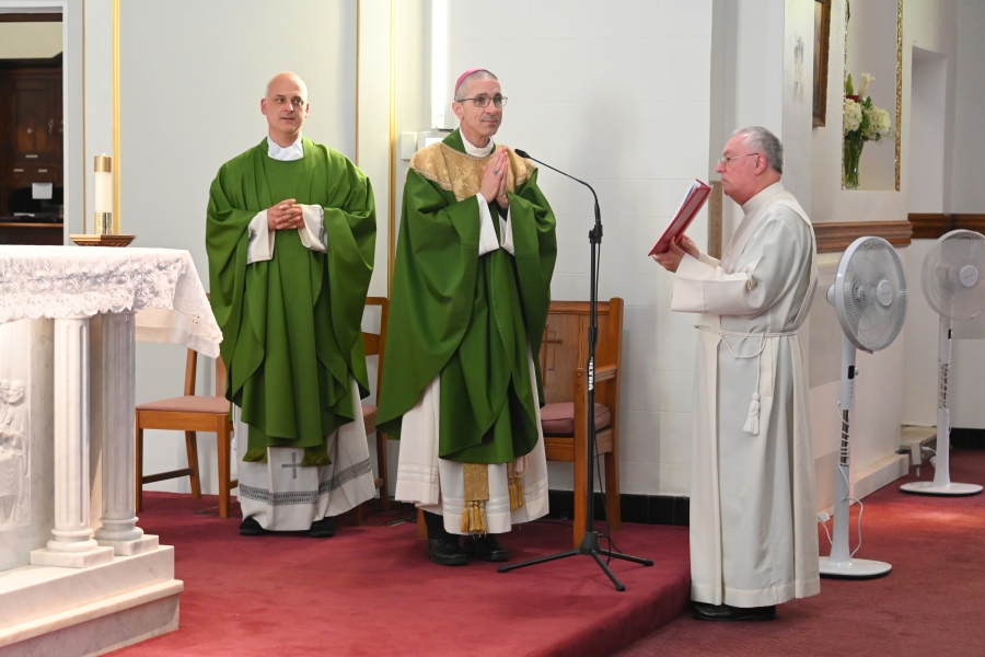 Bishop Ruggieri delivers the opening prayer, with Fr. Seamus Griesbach and Msgr. Marc Caron.