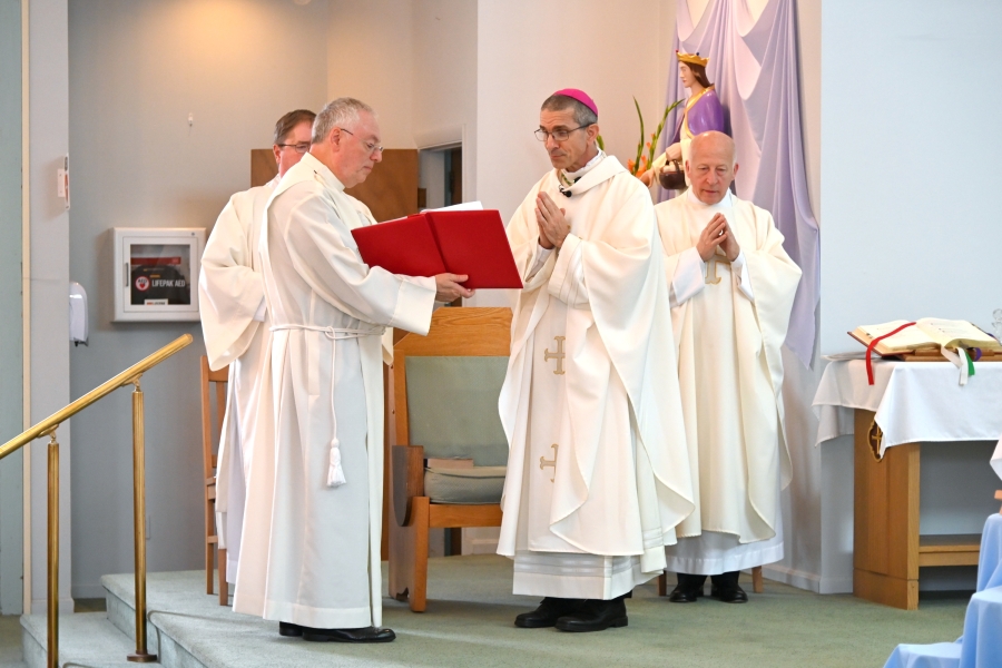 Bishop James Ruggieri gives the opening prayer.