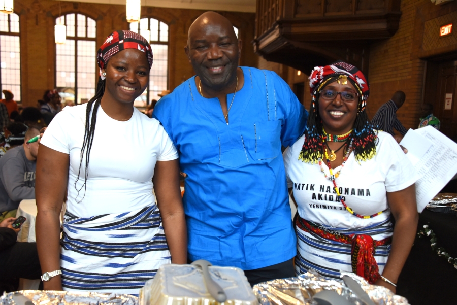 Man and two women at the African Festival.