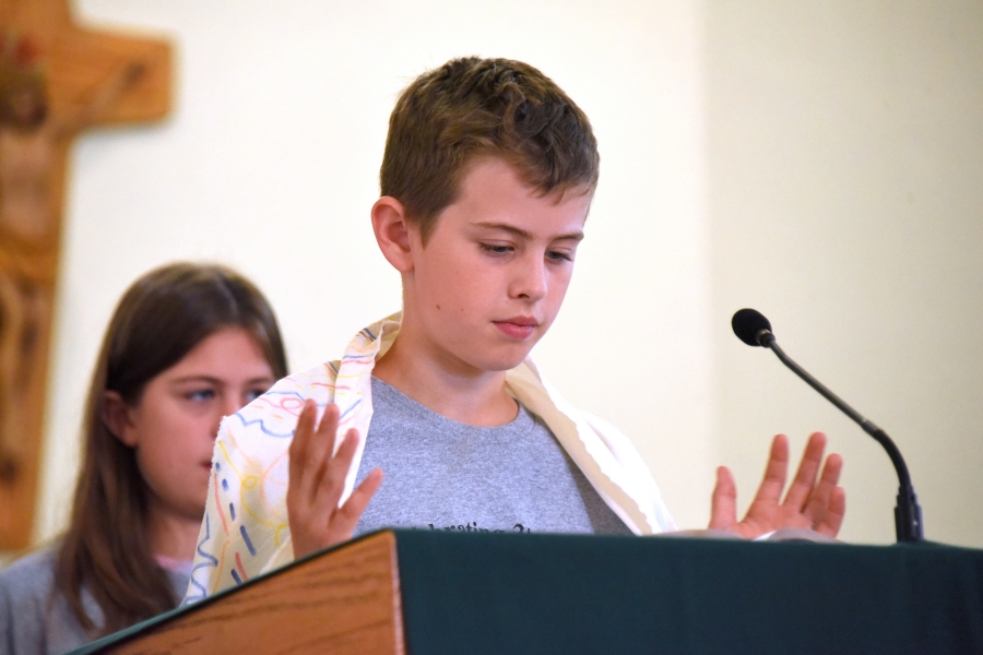 Boy leads the responsorial psalm.