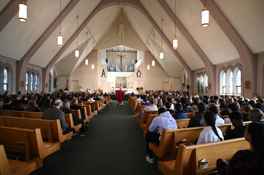 students sitting in church pews