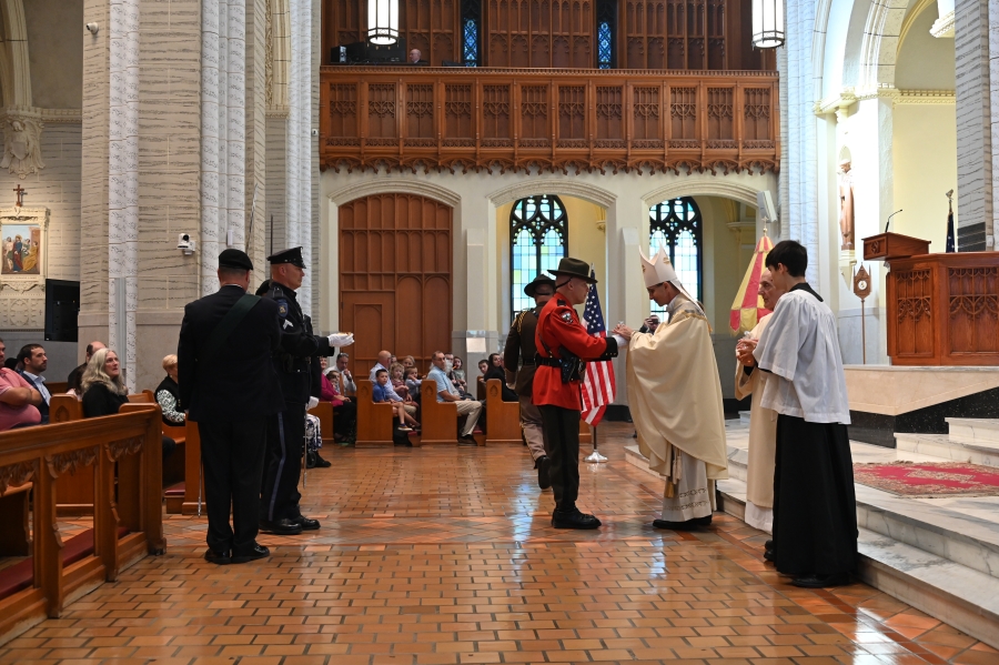 law enforcement bringing up liturgical gifts 