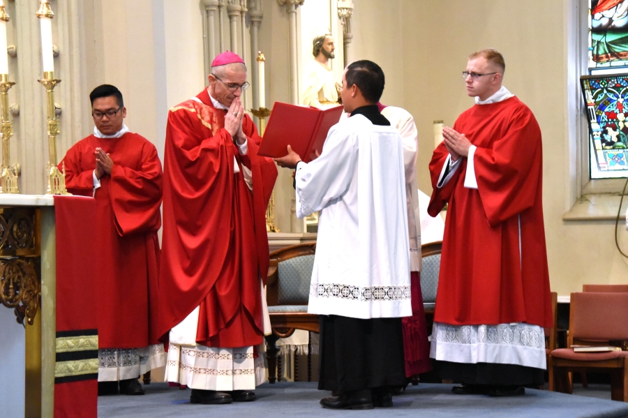 Bishop James Ruggieri gives the opening prayer.