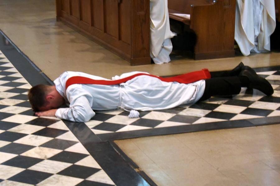 Deacon Matthew Valles lies prostrate.